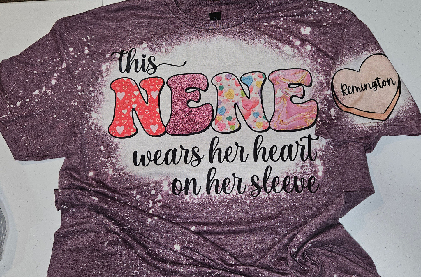 This Nene, Grandma, Gammy, Mama, Nana Wears Her Heart On Her Sleeve, W/ Additional Name Sleeve Bleached Unisex Tee
